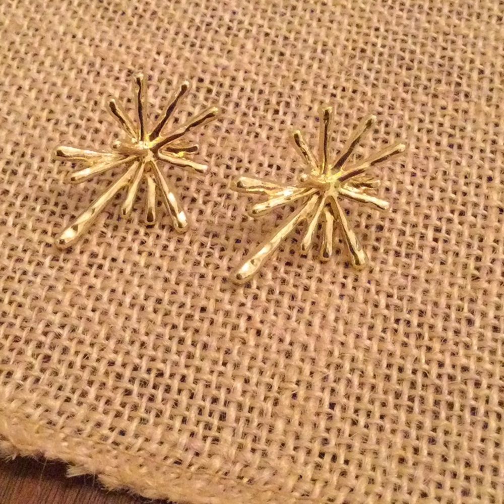 Gold tone star burst earrings